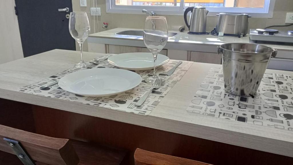 two empty wine glasses sitting on a kitchen counter at Atenea in Chivilcoy