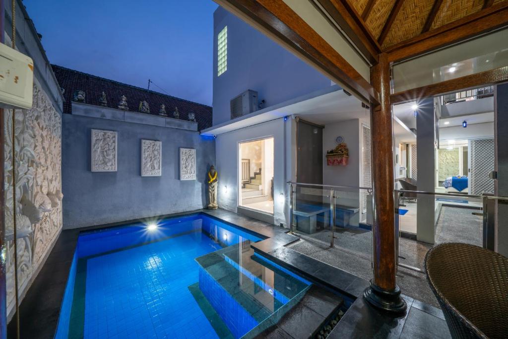 a swimming pool in a house at Modern villa with private pool , full kitchen and parking in Legian
