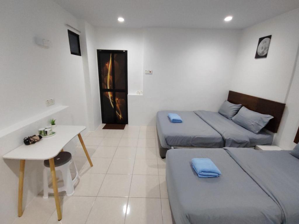 Postel nebo postele na pokoji v ubytování 184 GURNEY DRIVE PENANG
