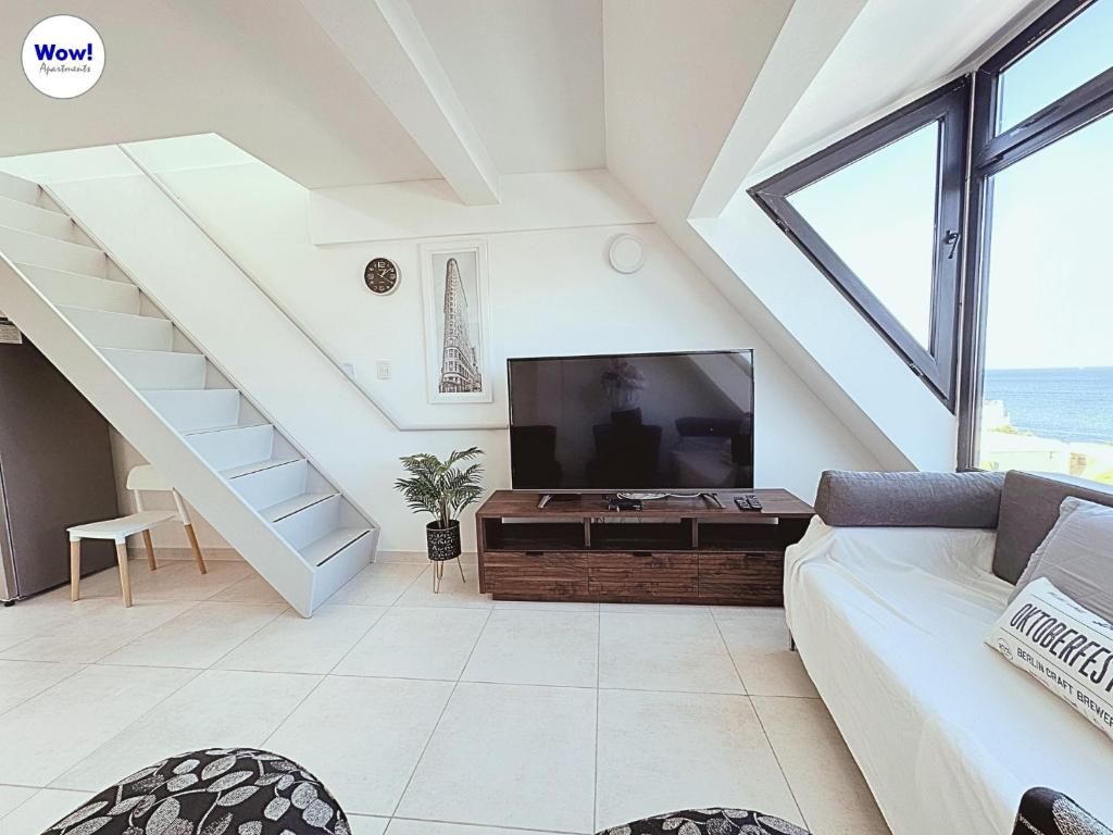 TV a/nebo společenská místnost v ubytování Wow! Ushuaia Apartments