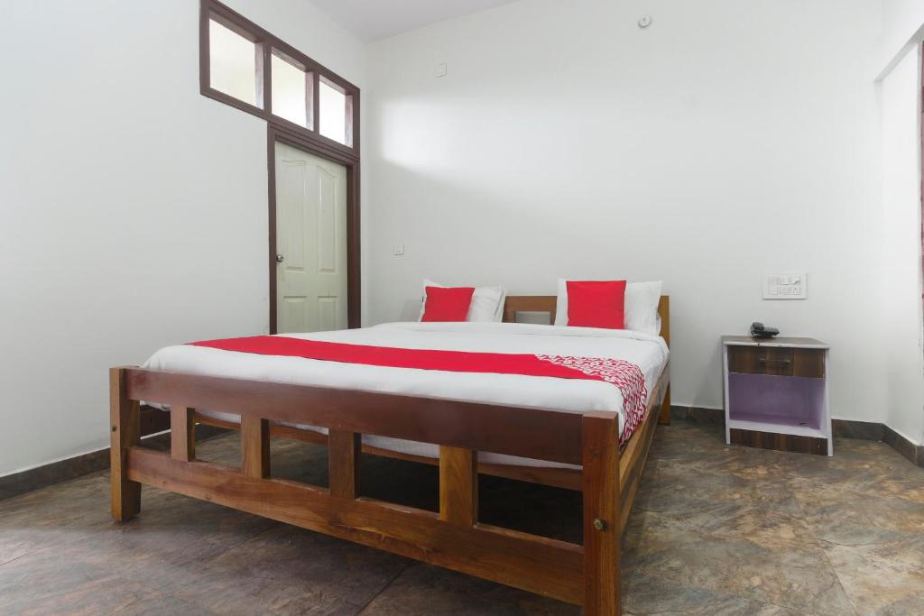 Letto o letti in una camera di OYO Sukha Service Apartment