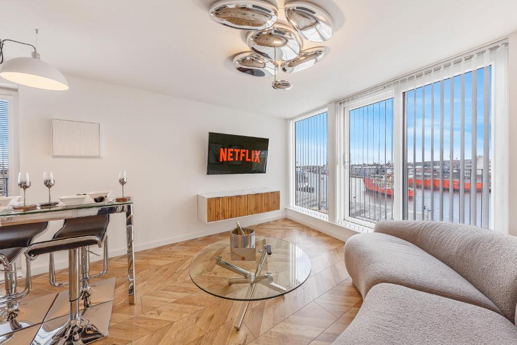 a living room with a couch and a table at Mearns Street Suite ✪ Grampian Lettings Ltd in Aberdeen