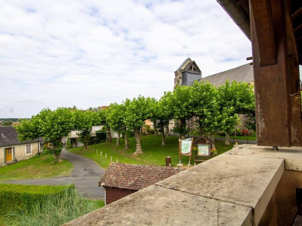 a view from a window of a village with trees at Gîte spacieux au cœur du Périgord - 2 Chambres, Terrasse, Parking - FR-1-616-213 in Saint-Mesmin