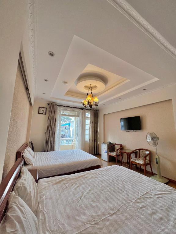 Postel nebo postele na pokoji v ubytování Dang Uyen 1 Hotel