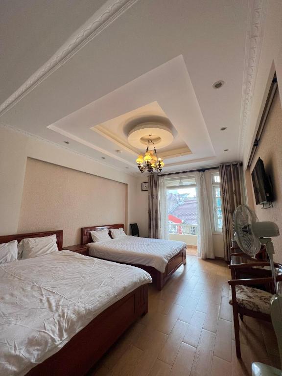 Postel nebo postele na pokoji v ubytování Dang Uyen 1 Hotel