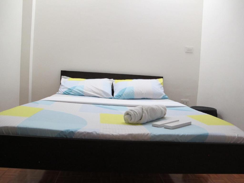 Postel nebo postele na pokoji v ubytování Leo Green Apartelle