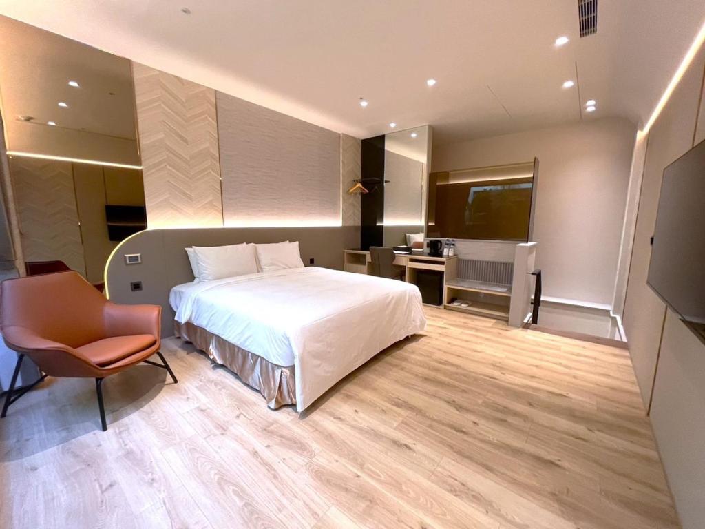 Postel nebo postele na pokoji v ubytování 晶盈親旅大酒店