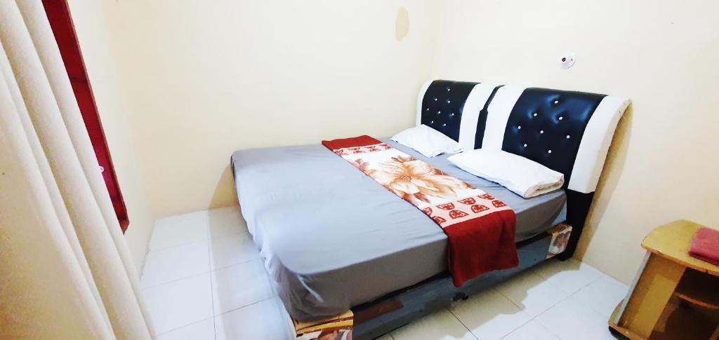 Postel nebo postele na pokoji v ubytování Aman's Guesthouse