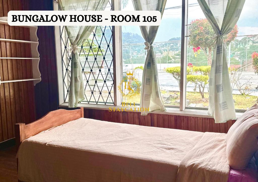 Postel nebo postele na pokoji v ubytování Baguio BELL Staycation