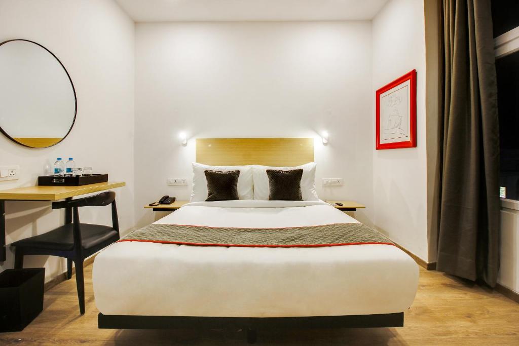 Un pat sau paturi într-o cameră la Townhouse Rcc Prime
