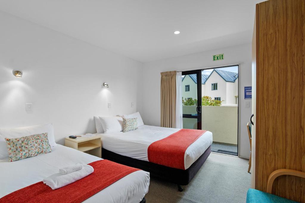 Postel nebo postele na pokoji v ubytování Bella Vista Motel & Apartments Christchurch