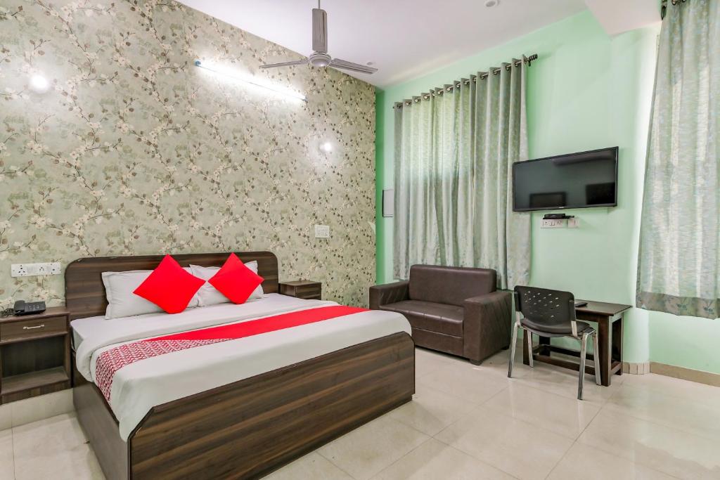 Postelja oz. postelje v sobi nastanitve OYO Hotel Bigas
