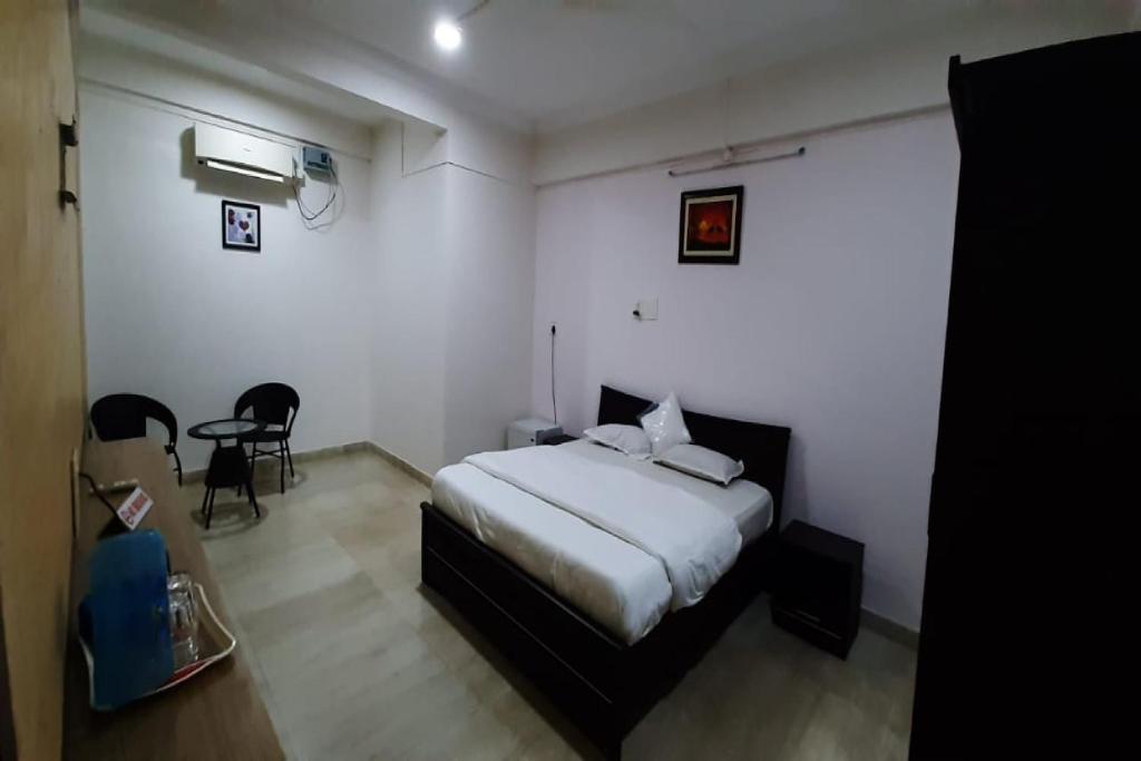 Cama o camas de una habitación en OYO Konkan House
