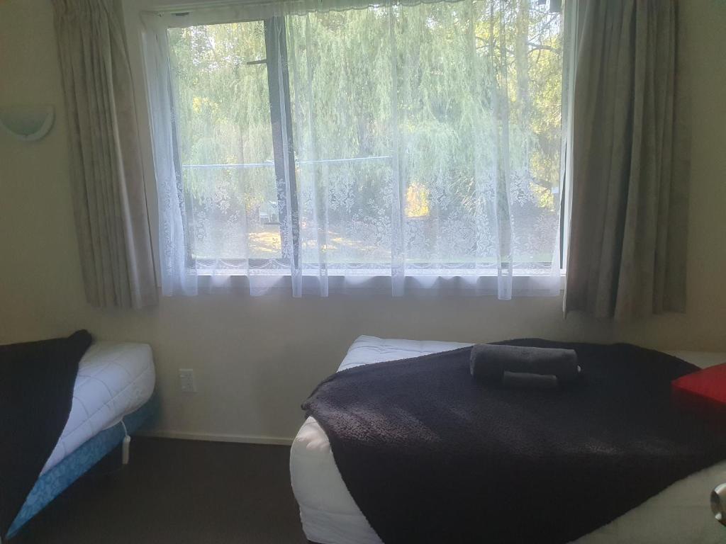 Postel nebo postele na pokoji v ubytování Geraldine Motels