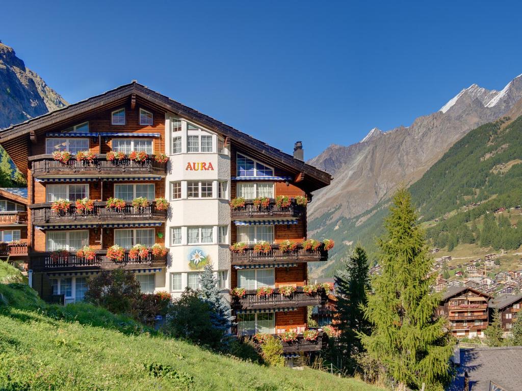 a hotel on the side of a mountain at Apartments Aura in Zermatt