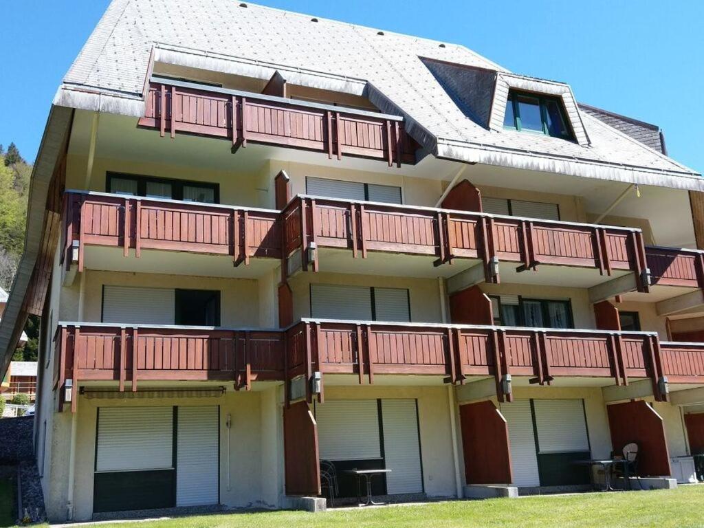 an apartment building with red balconies on it at Todtmoos Modern retreat in Todtmoos