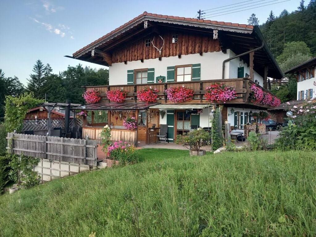 a house with flowers on the front of it at Hirschbichler Modern retreat in Berchtesgaden