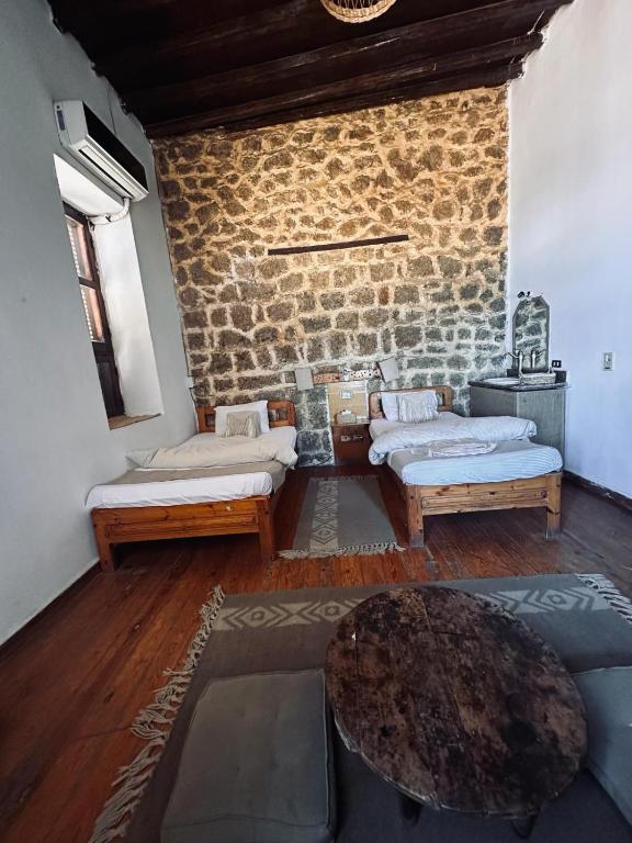 Ένα ή περισσότερα κρεβάτια σε δωμάτιο στο El Quseir Hotel