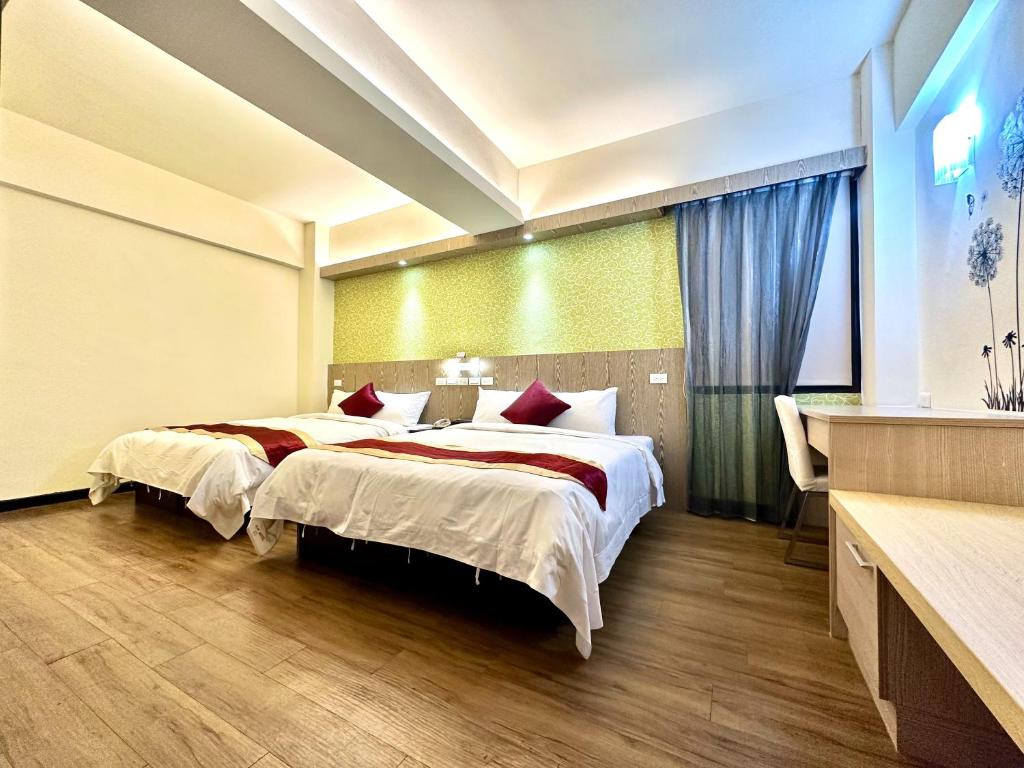 Postel nebo postele na pokoji v ubytování Zhao Lai Hotel