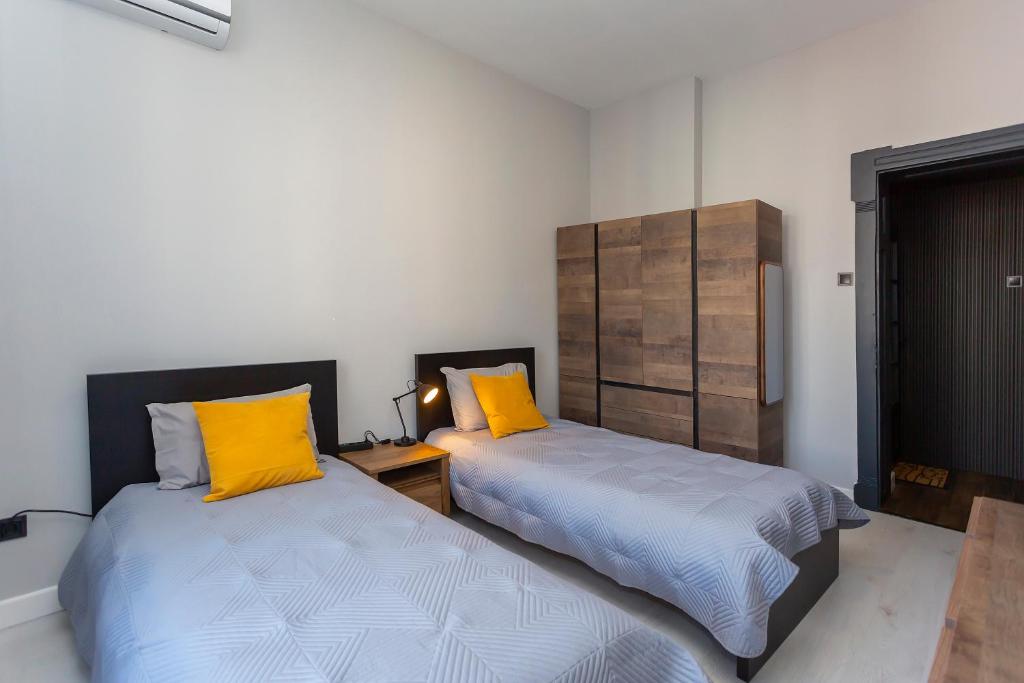 Postel nebo postele na pokoji v ubytování Urban Elegance Apartment