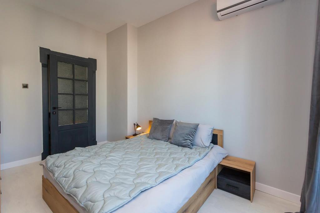 Postel nebo postele na pokoji v ubytování Urban Elegance Apartment