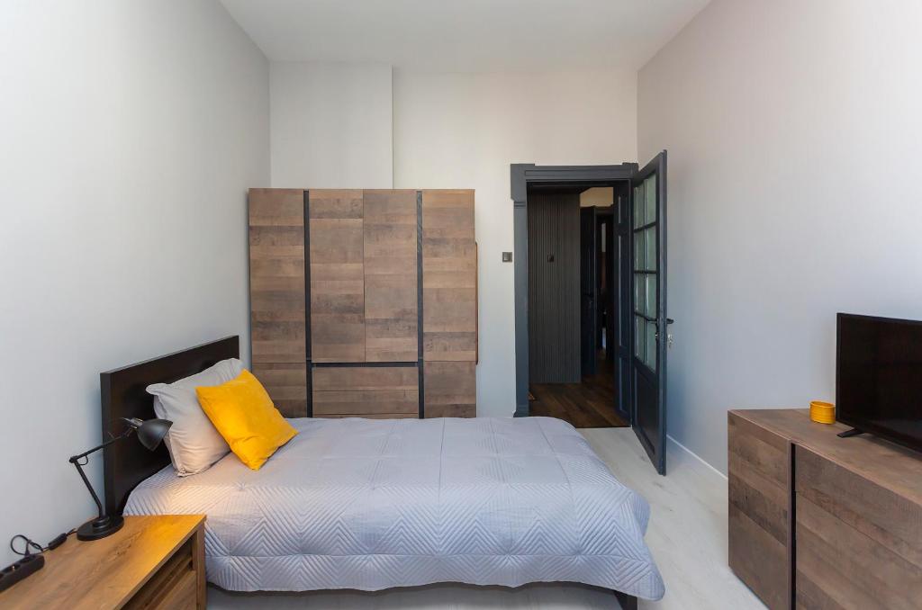 Postel nebo postele na pokoji v ubytování Urban Elegance Apartment