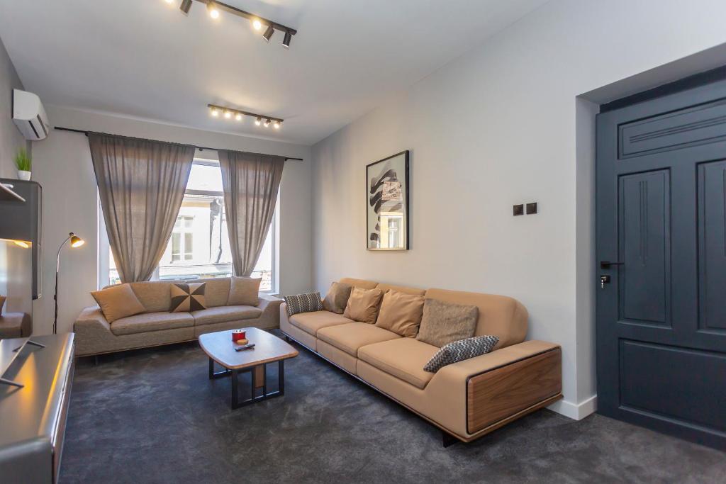 Posezení v ubytování Urban Elegance Apartment