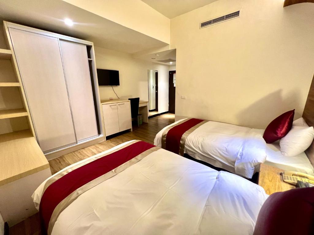 Postel nebo postele na pokoji v ubytování Zhao Lai Hotel