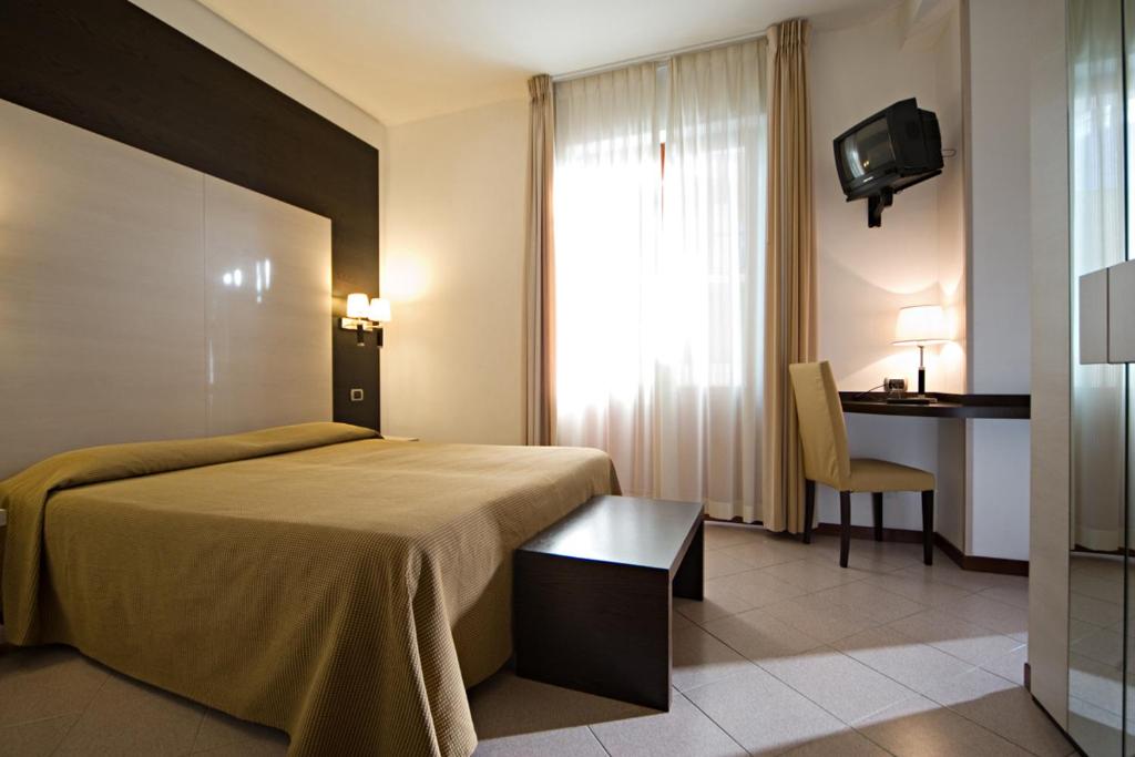 Postel nebo postele na pokoji v ubytování Albergo La Marina B&B