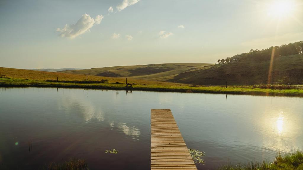 a wooden dock in the middle of a lake at Moonlight Meadows just outside Dullstoom in Dullstroom