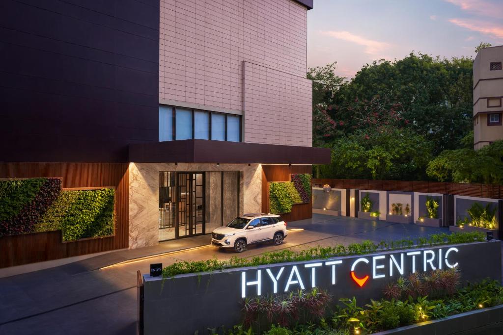 a rendering of a hyatt centric building with a car parked outside at Hyatt Centric Ballygunge Kolkata in Kolkata