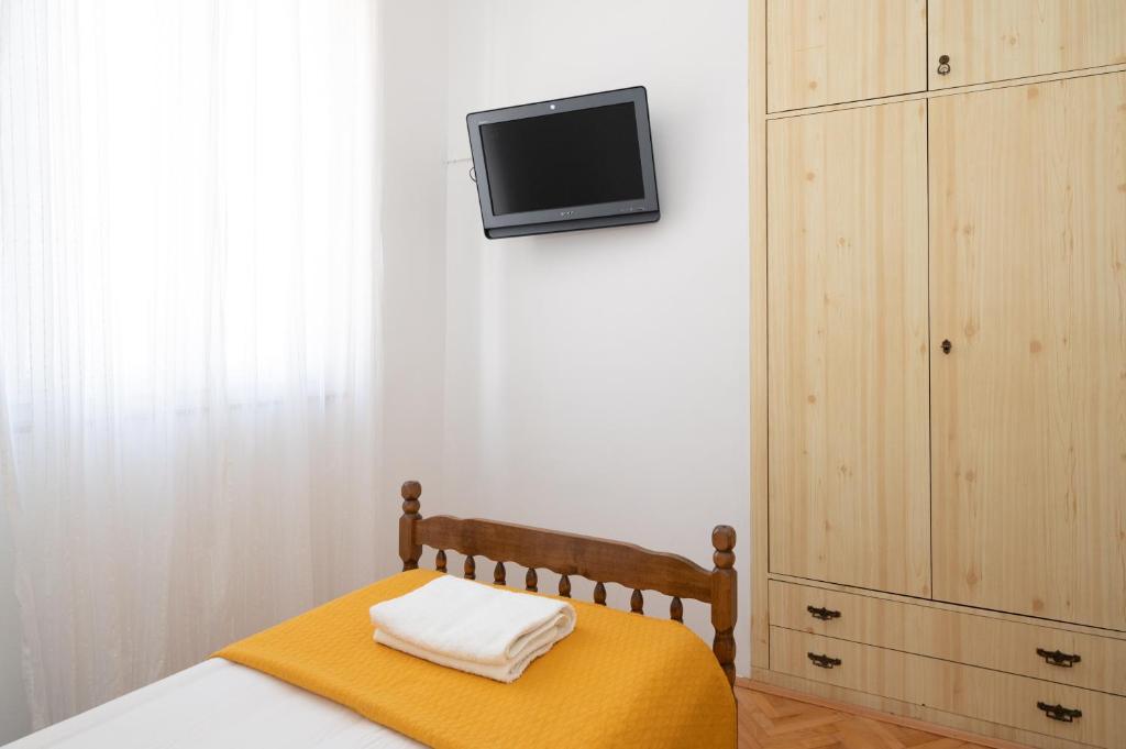 Postel nebo postele na pokoji v ubytování Piano Apartment