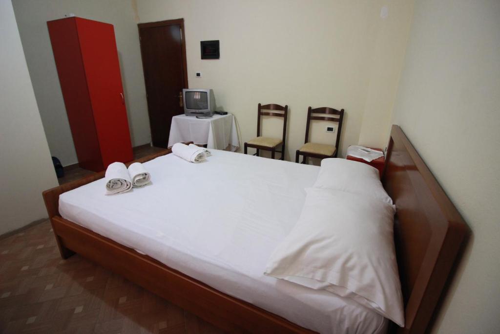 Postel nebo postele na pokoji v ubytování HOTEL RESTORANT VIKTORIA