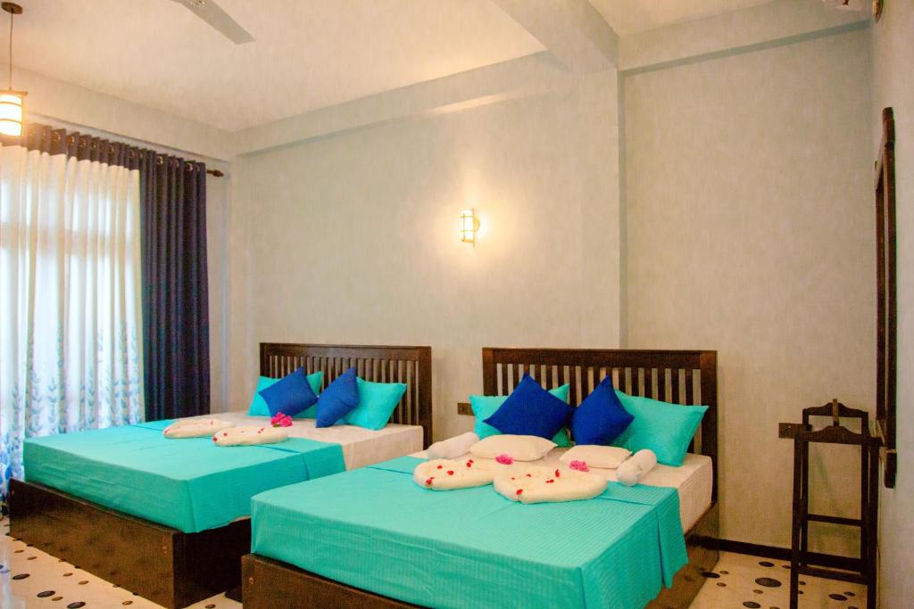 Postel nebo postele na pokoji v ubytování My Resort Yala