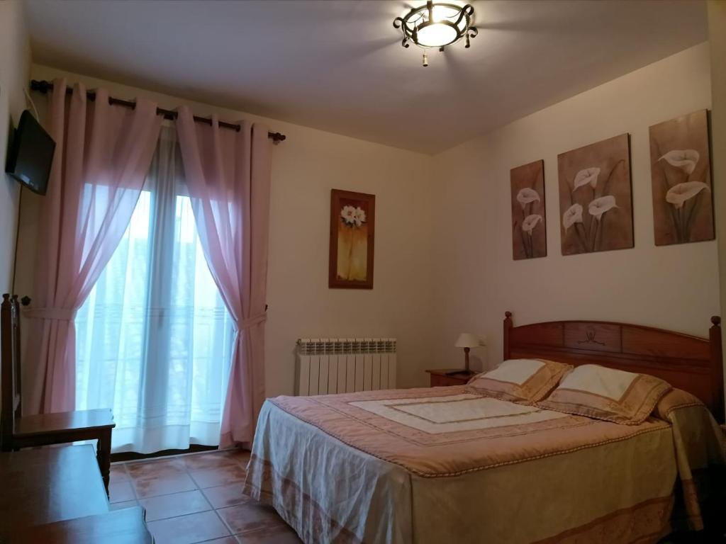 Postel nebo postele na pokoji v ubytování LA POSADA DEL HORNO