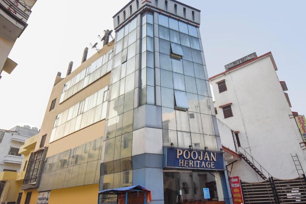 a building with a sign for the polish heritage at Hotel Poojan Heritage in Haridwār