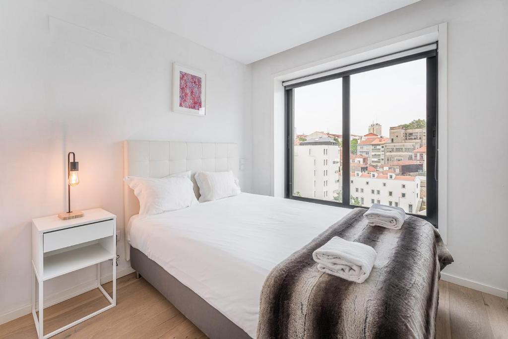 Postel nebo postele na pokoji v ubytování GuestReady - Cosy spot near Porto city centre