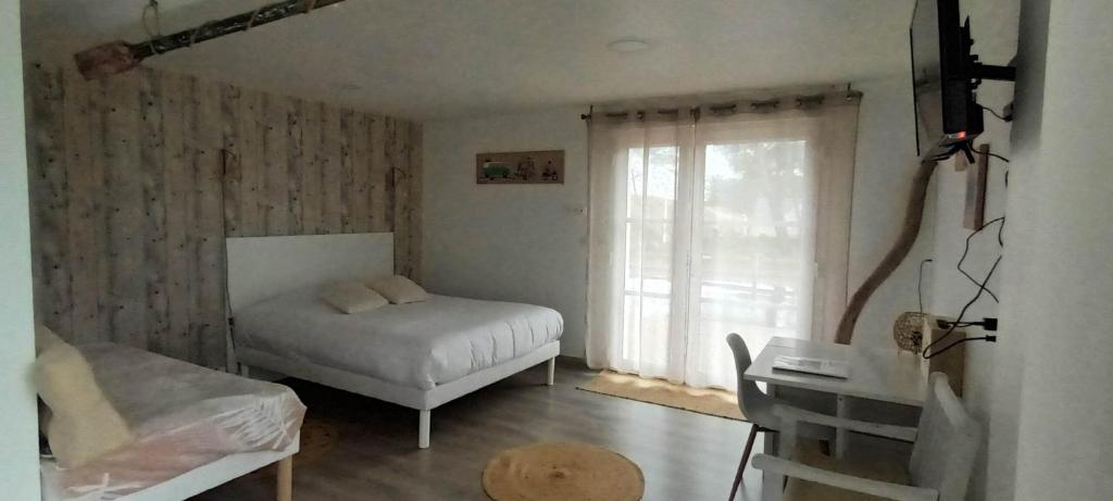Postel nebo postele na pokoji v ubytování Escales dans les dunes