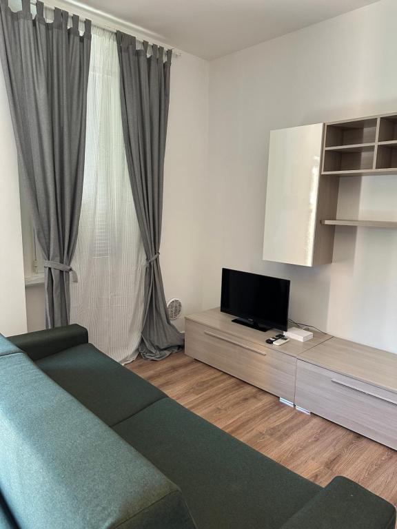 TV a/nebo společenská místnost v ubytování CA DEL TRIMA