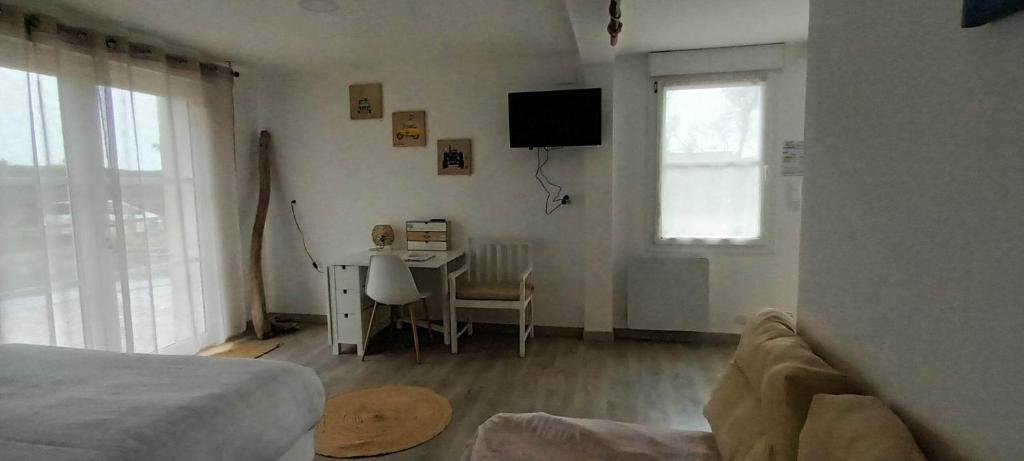 TV a/nebo společenská místnost v ubytování Escales dans les dunes