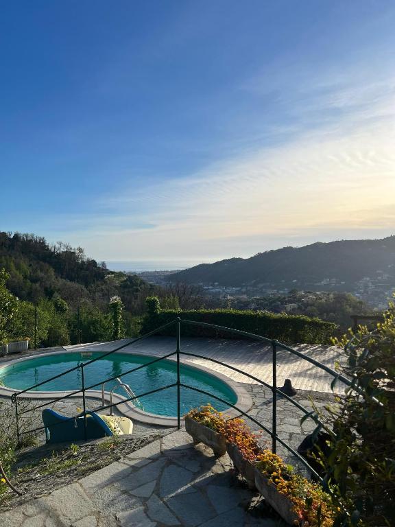 a swimming pool with a view of a mountain at A.R.L.A. House in Cogorno