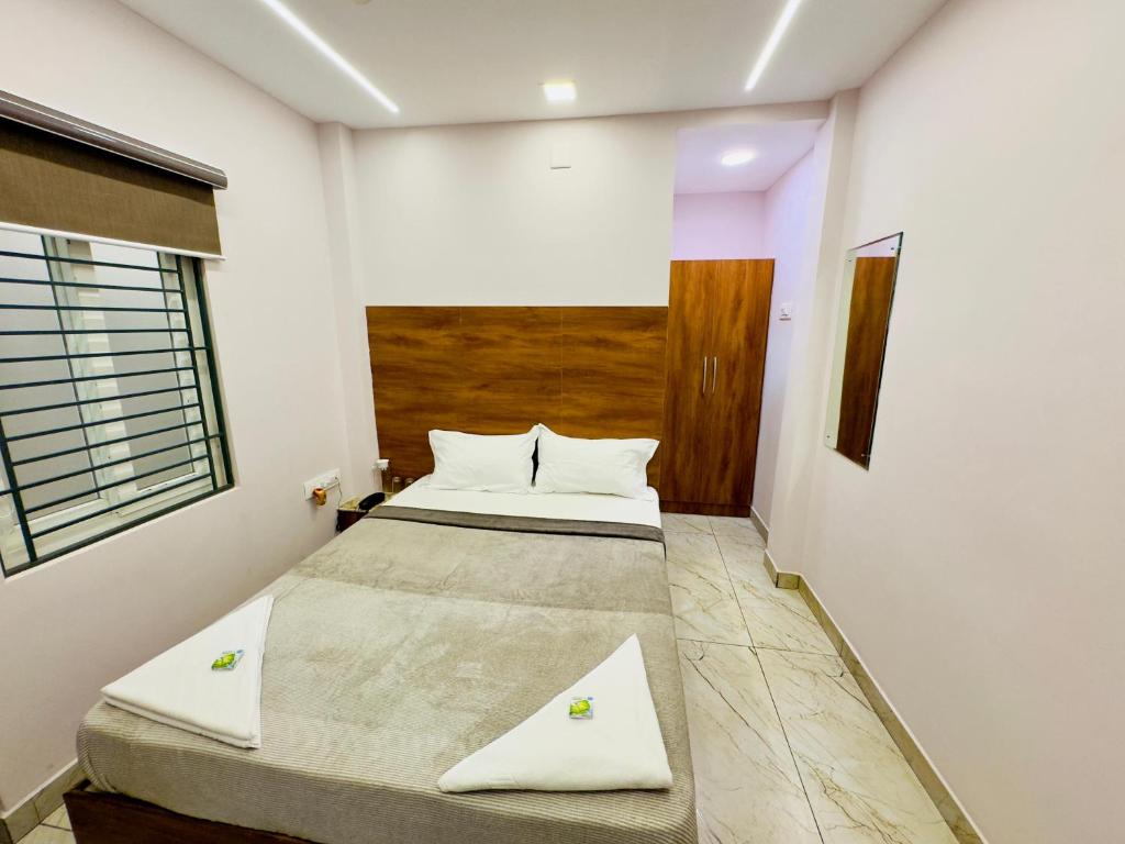 Postel nebo postele na pokoji v ubytování GREENS INN near Madras High Court and Harbour Chennai Port