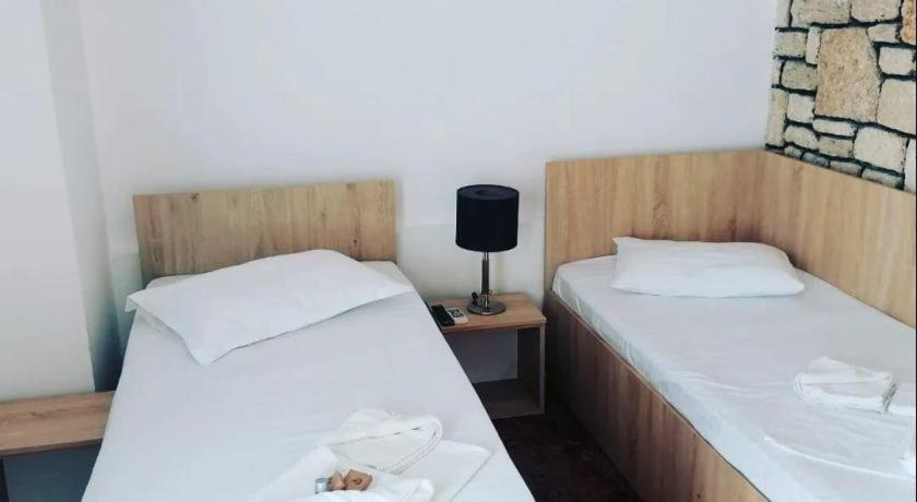 Postel nebo postele na pokoji v ubytování Hotel Mercur