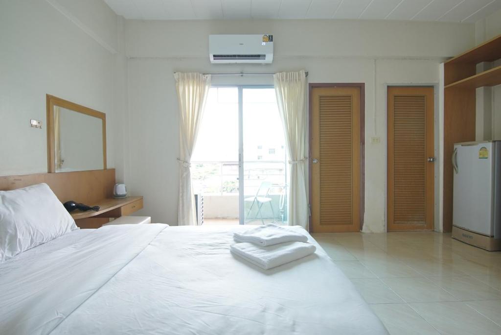 Posteľ alebo postele v izbe v ubytovaní โกอินน์ สนามบินสุวรรณภูมิ GO INN Suvarnabhumi Airport
