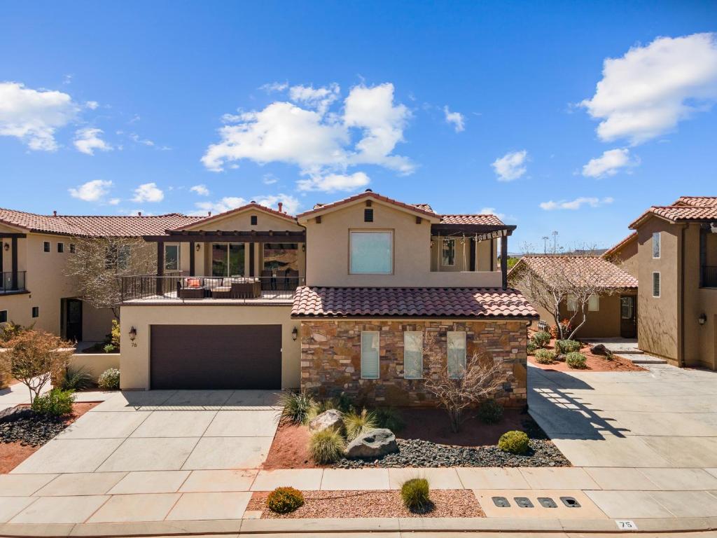 a home in the desert with a driveway at Double the Fun combo - Canyon Springs 76 and Desert Moose 75 home in Santa Clara