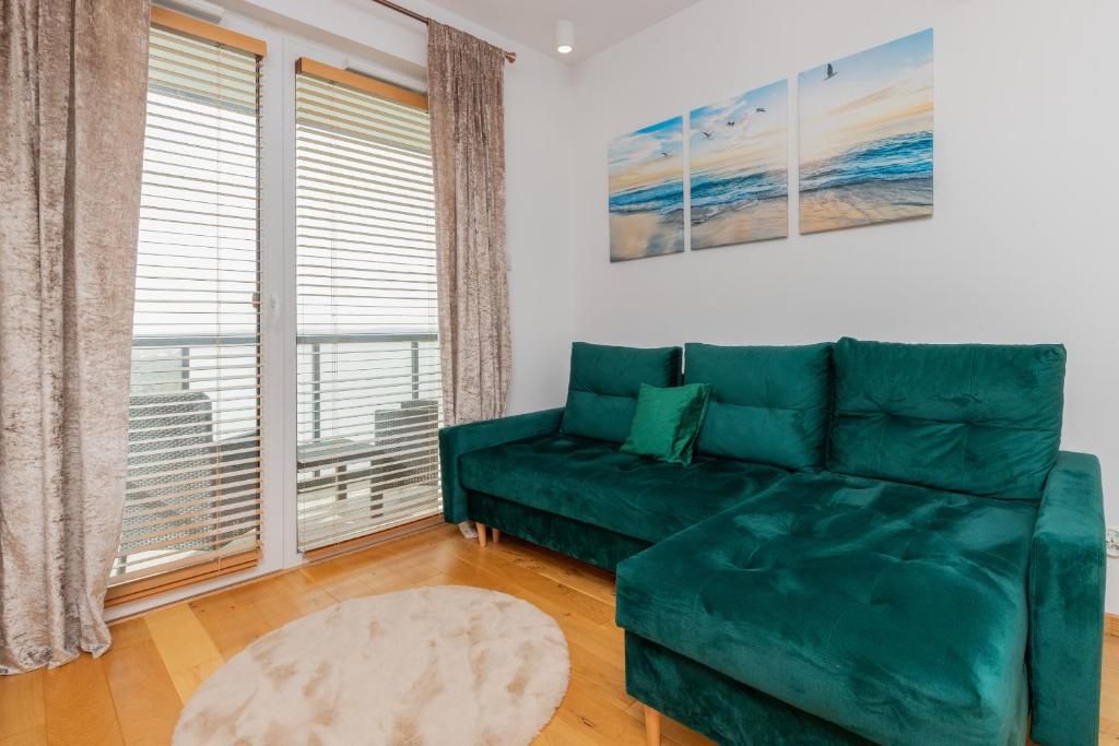 Posezení v ubytování Nowa Letnica Apartament z Parkingiem i Balkonem przy Stadionie Polsat Plus Arena Gdańsk by Noclegi Renters