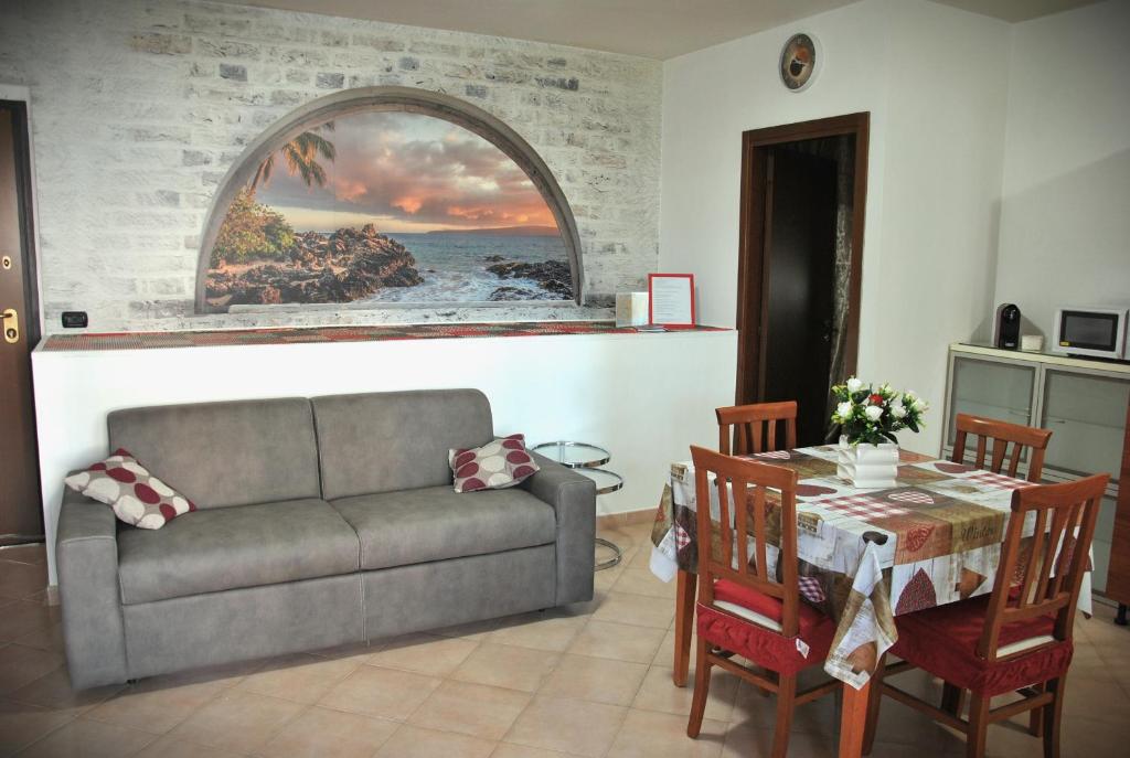 a living room with a couch and a table at Alloggio di Giorgia in Fiumicino