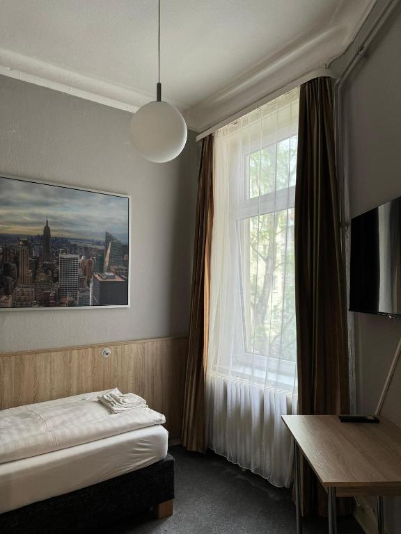 Postel nebo postele na pokoji v ubytování Hotel Kieler Hof am Hauptbahnhof - Hamburg Central Station