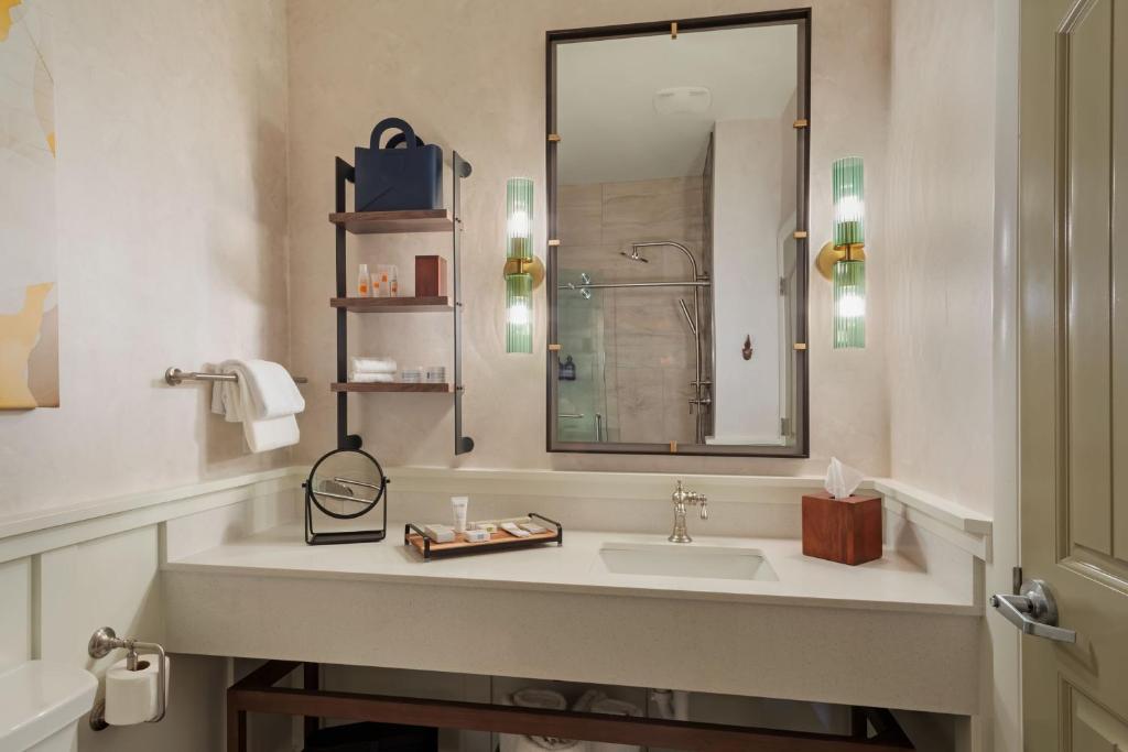 a bathroom with a sink and a mirror at The Red Cliffs Lodge Zion, a Tribute Portfolio Hotel in Springdale