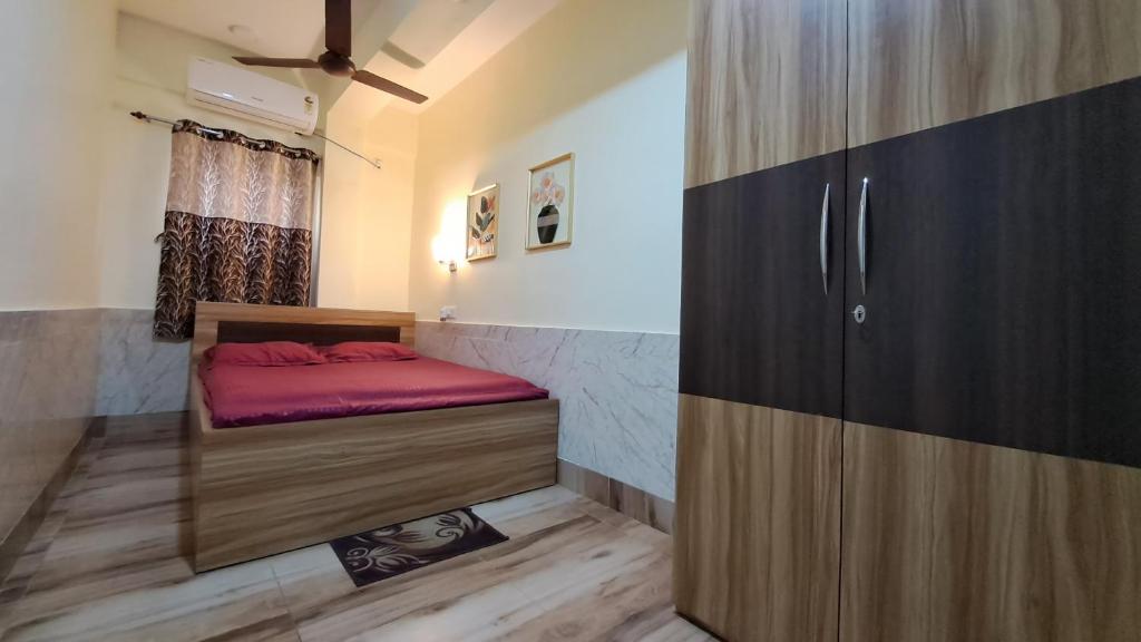 Ein Bett oder Betten in einem Zimmer der Unterkunft Laxmi Niwas, Salt Lake, Kolkata, 10mins from Sector 5